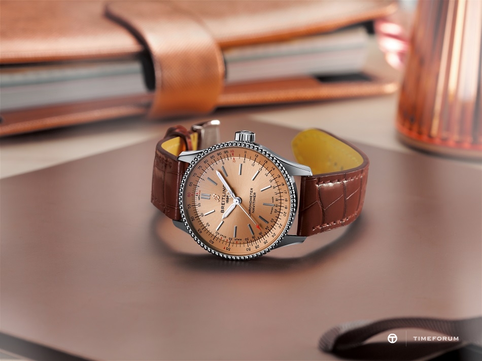 04_navitimer-automatic-35-with-a-copper-colored-dial-and-a-brown-alligator-leather-strap-1.jpg